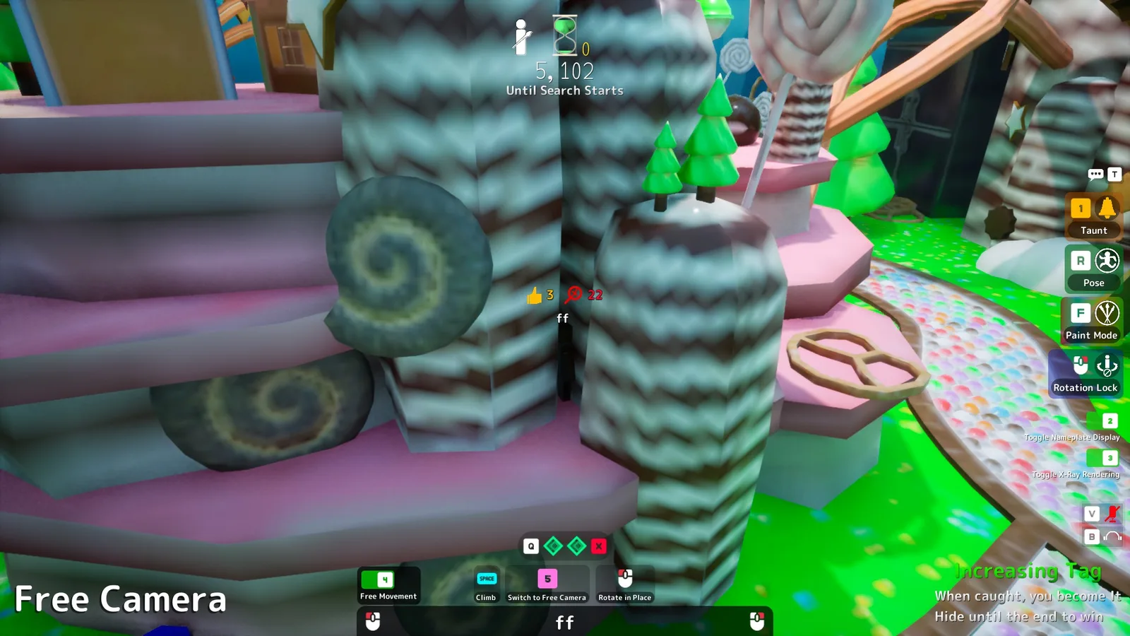 A hider painted dark wedged in the crevice between striped chocolate towers in Sugar Land