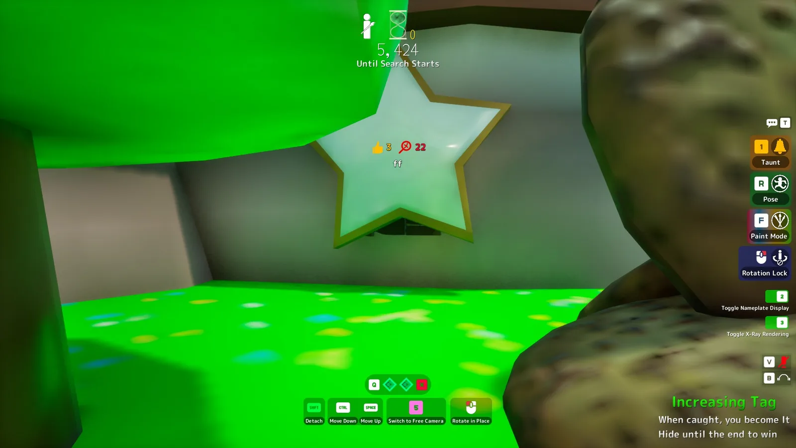A hider attached behind a star decoration on a wall, with the game's detach and height-adjust controls visible in the HUD
