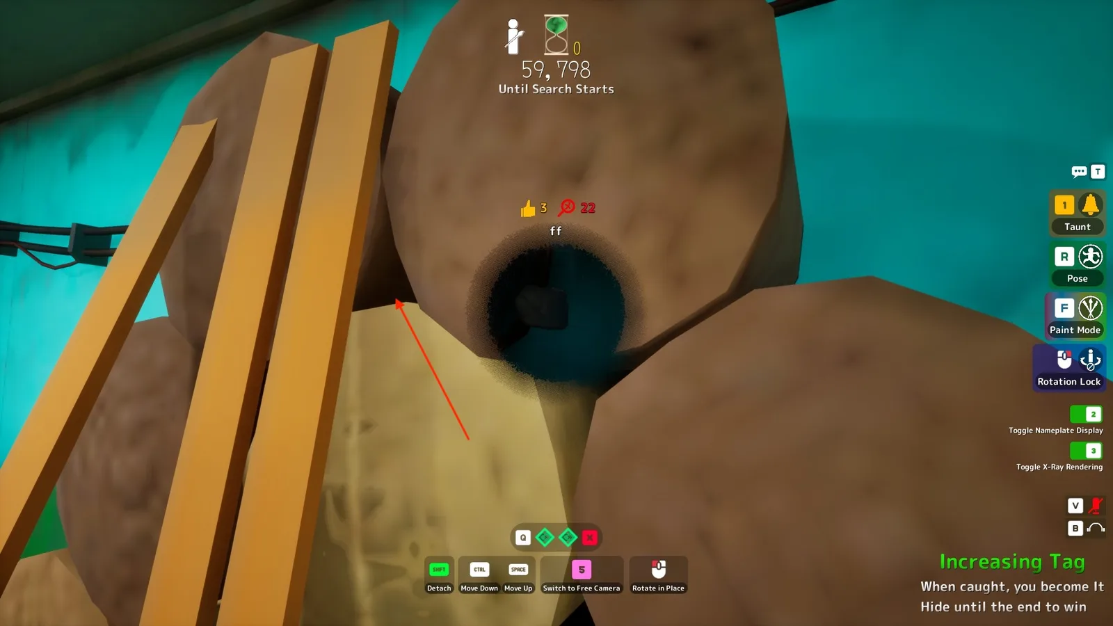 A hider painted dark inside the hollow of stacked hay rolls, with detach and height controls visible